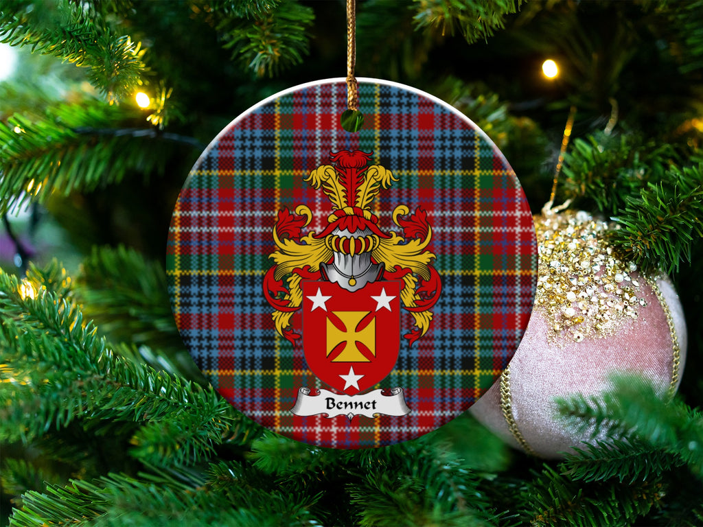 Bennet Scottish clan ceramic ornament with family crest on a Caledonia tartan background, hanging on a Christmas tree