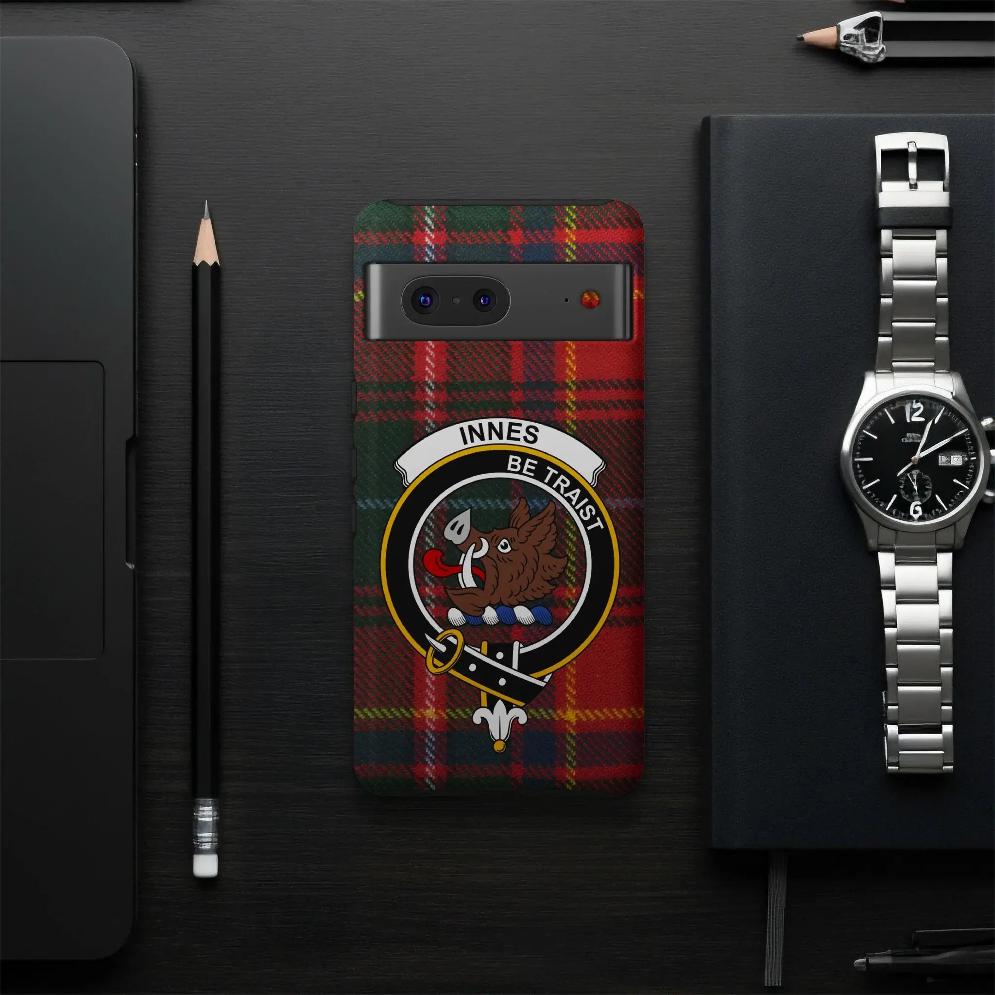 Innes Be Traist crest plaid smartphone case flat lay — full boar's head clan design visible