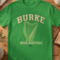 Burke Irish harp T-shirt in Irish Green, with cream surname lettering, a gold-toned harp, green shamrock and “Irish Heritage” text.