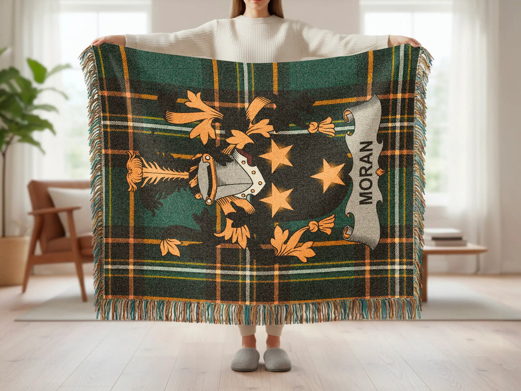Tartan throw blanket with Moran clan crest and gold accents.