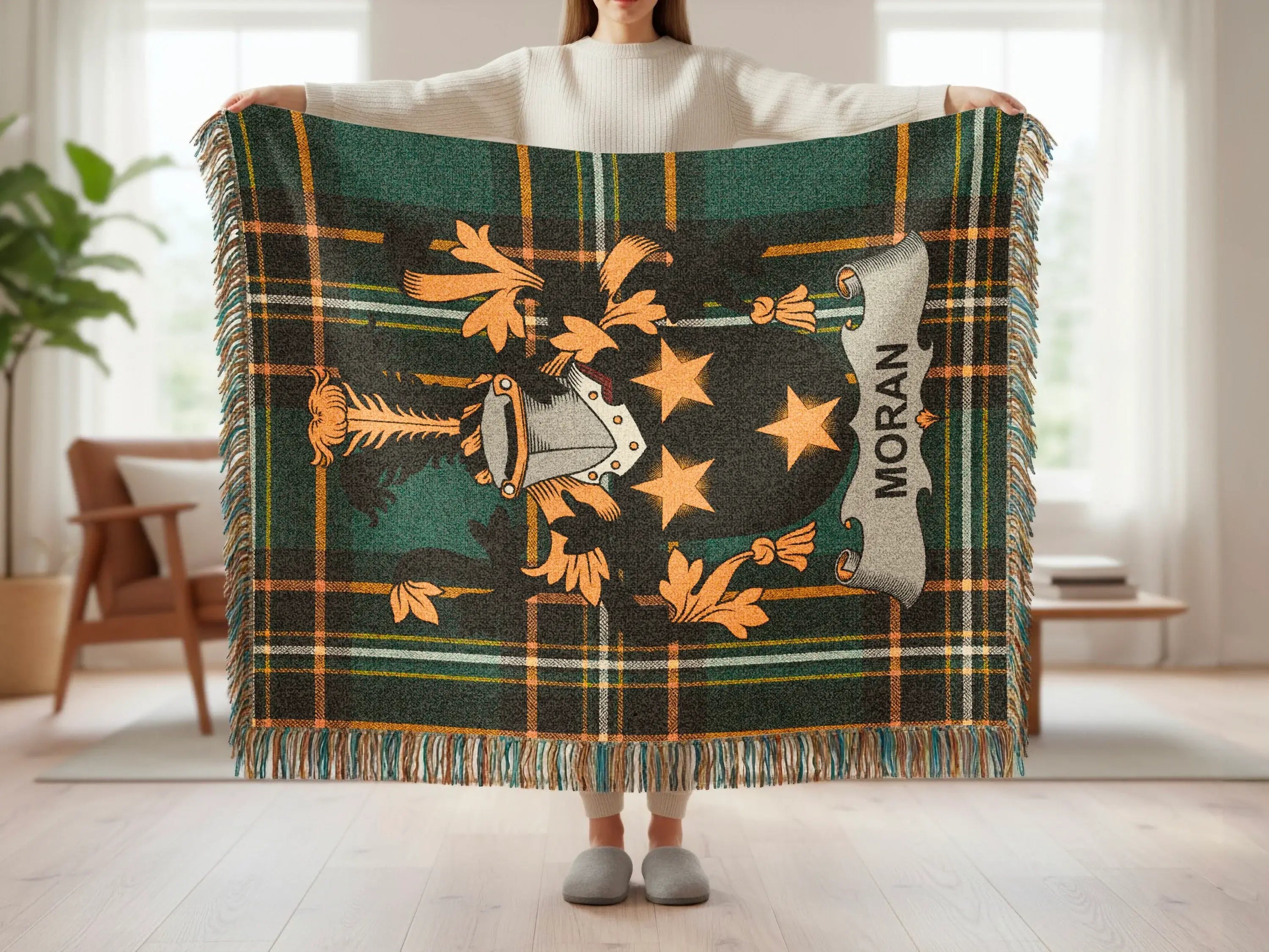 Tartan throw blanket with Moran clan crest and gold accents.