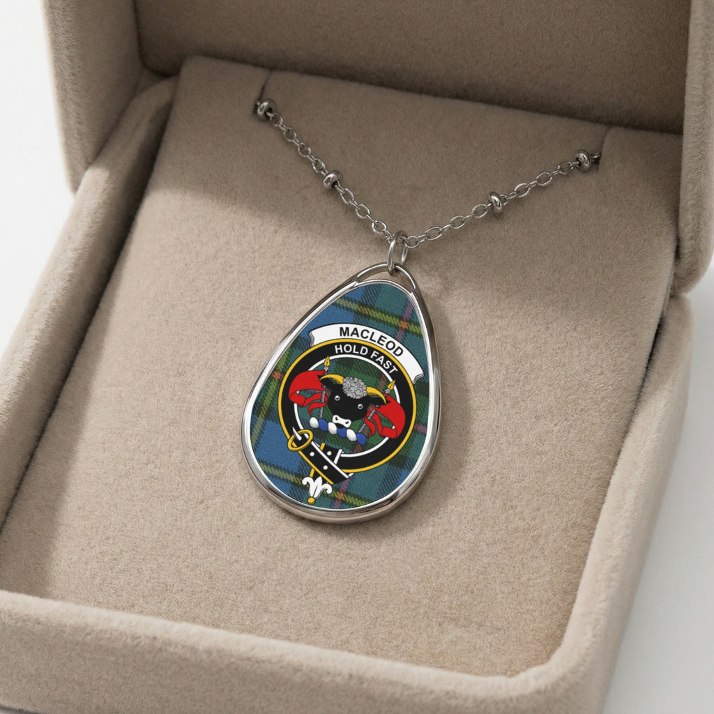 Pendant with MacLeod tartan and crest in a beige jewelry box.