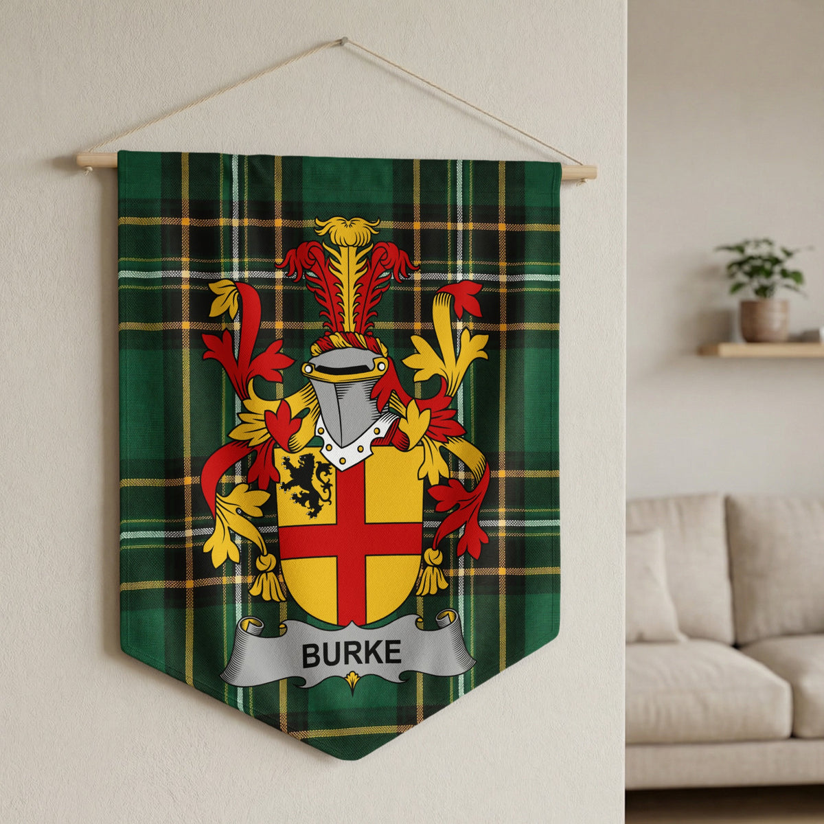 Burke surname emblem banner on green tartan fabric hanging on a wall.