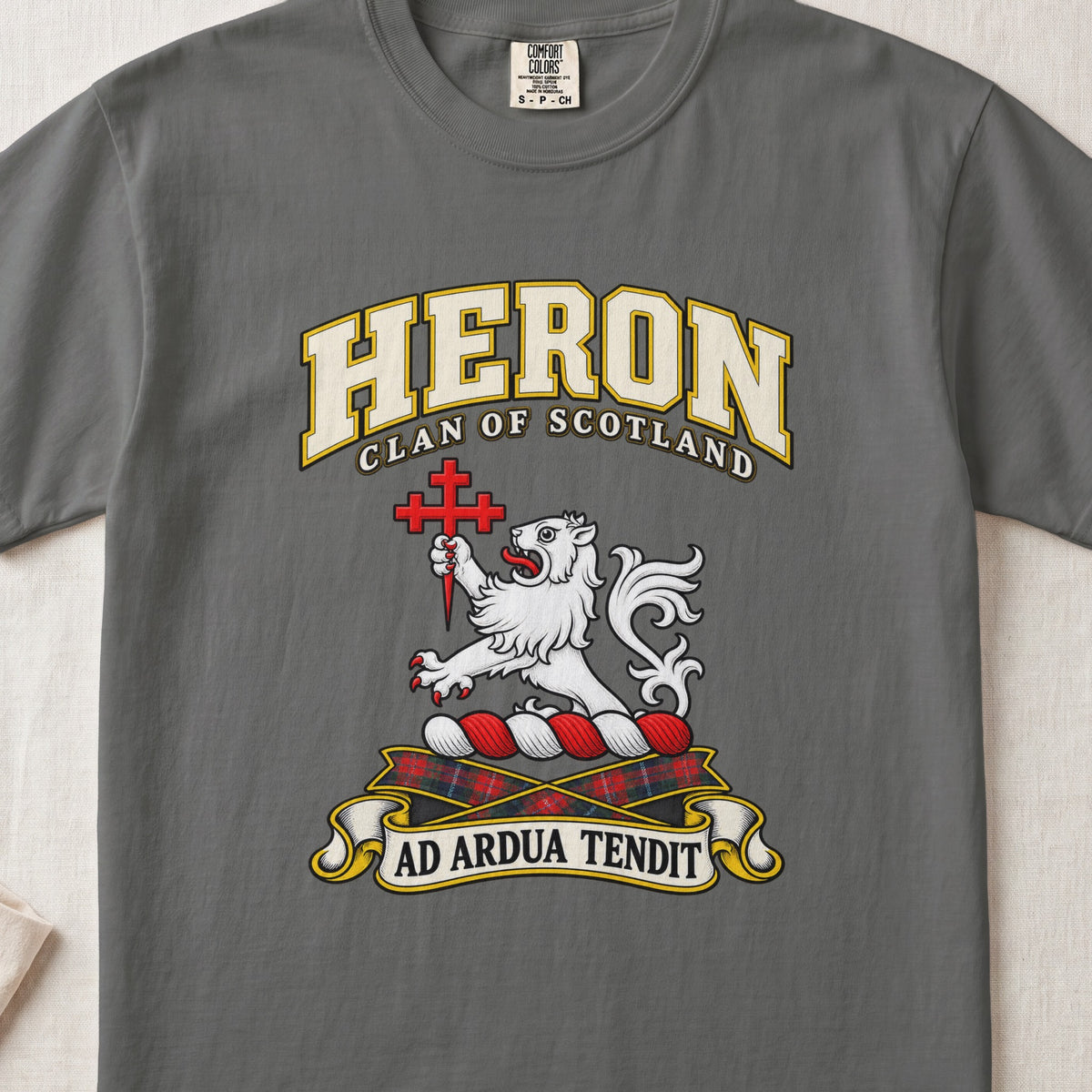 Heron Scottish clan T-shirt in Pepper, front view with a white lion holding a red cross and motto banner.