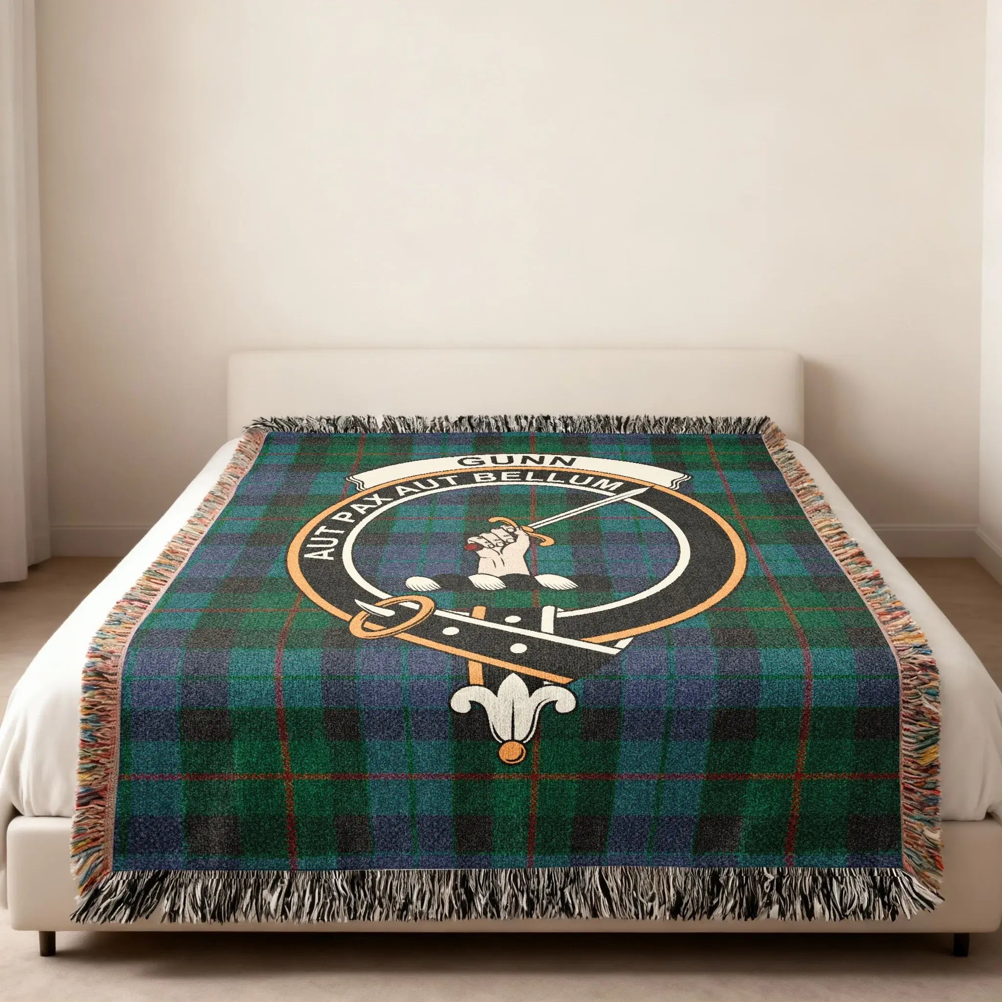 Gunn Aut Pax Aut Bellum crest woven blanket — sword heraldic design at centre, fringe edge