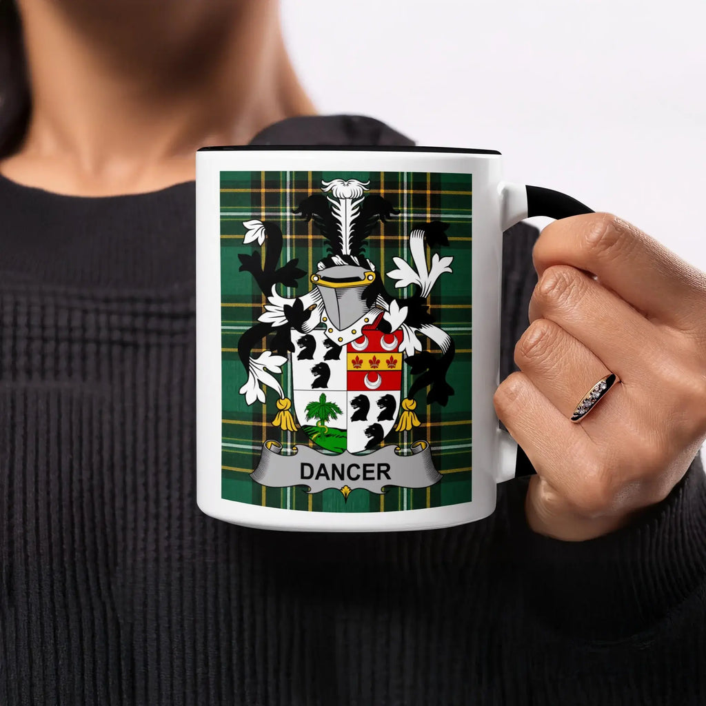 Mug with a green plaid background featuring the Dancer family crest.