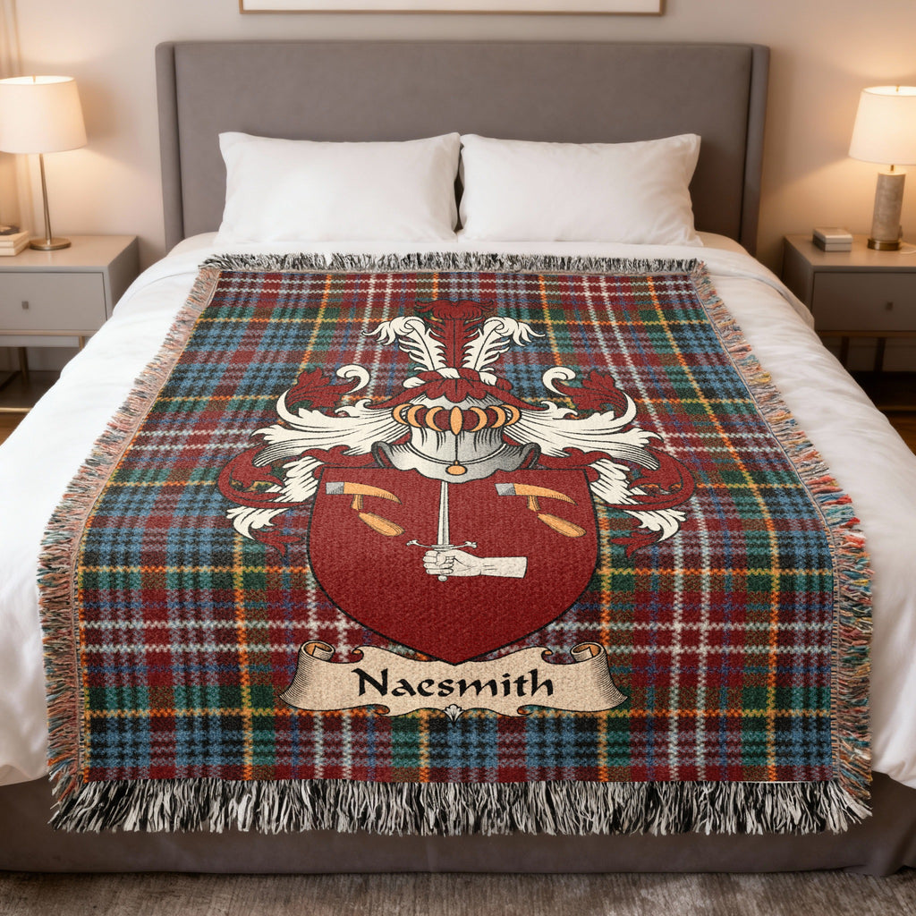 Naesmith family crest emblem on a Caledonia tartan woven blanket