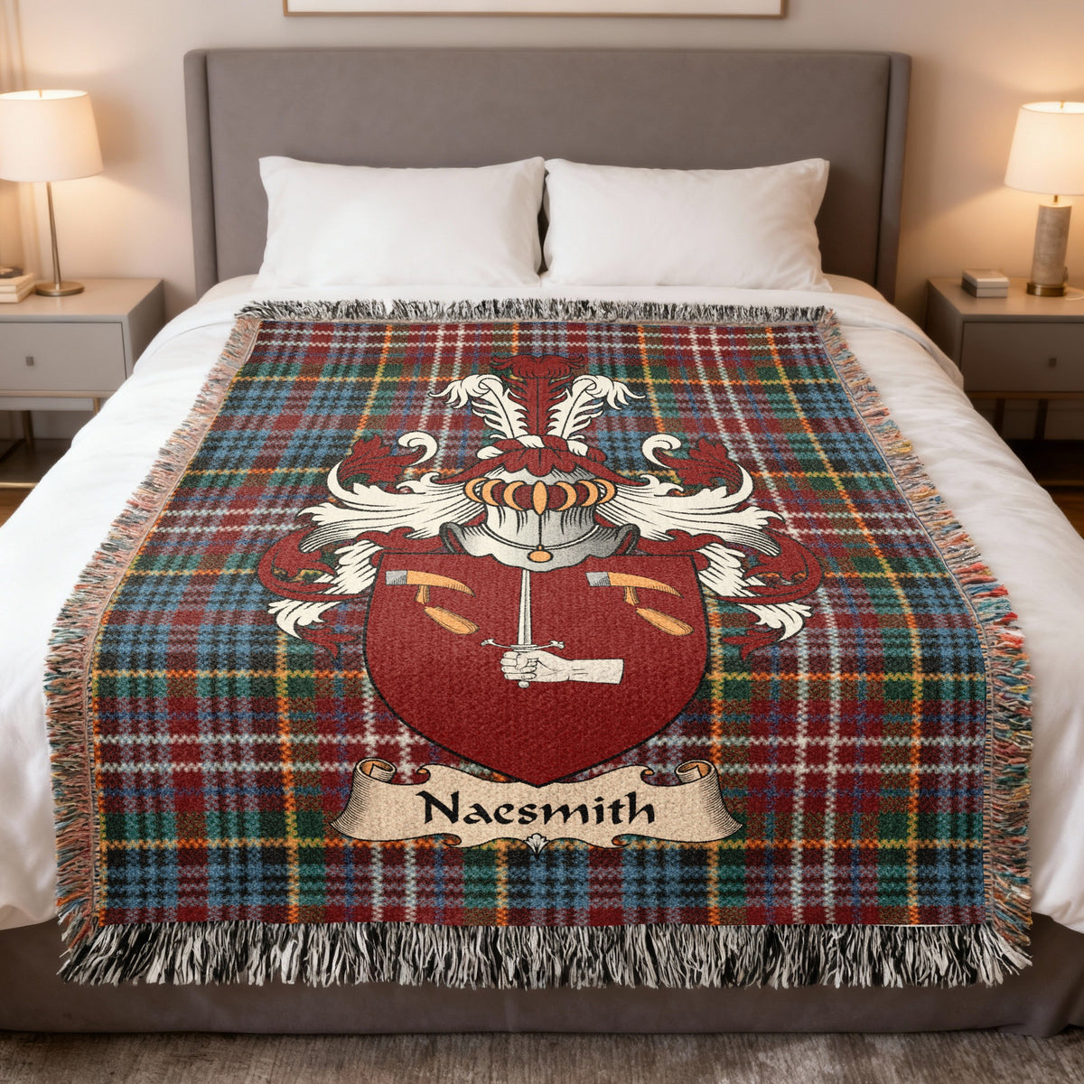 Naesmith family crest emblem on a Caledonia tartan woven blanket