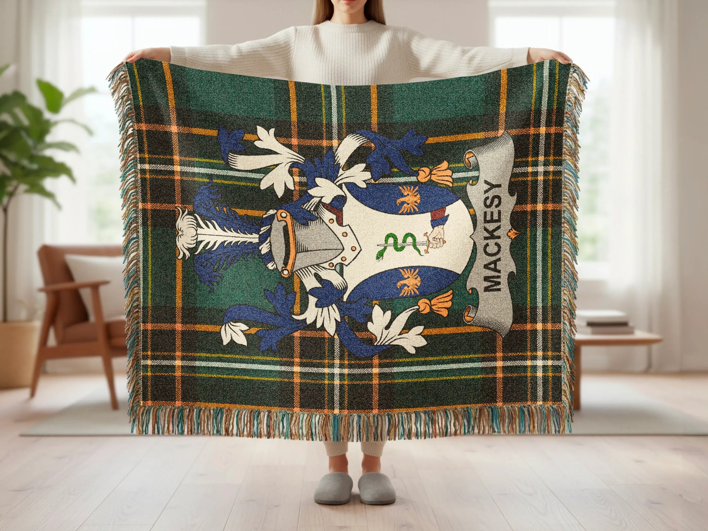 Mackey tartan blanket with family crest and fringe detail.