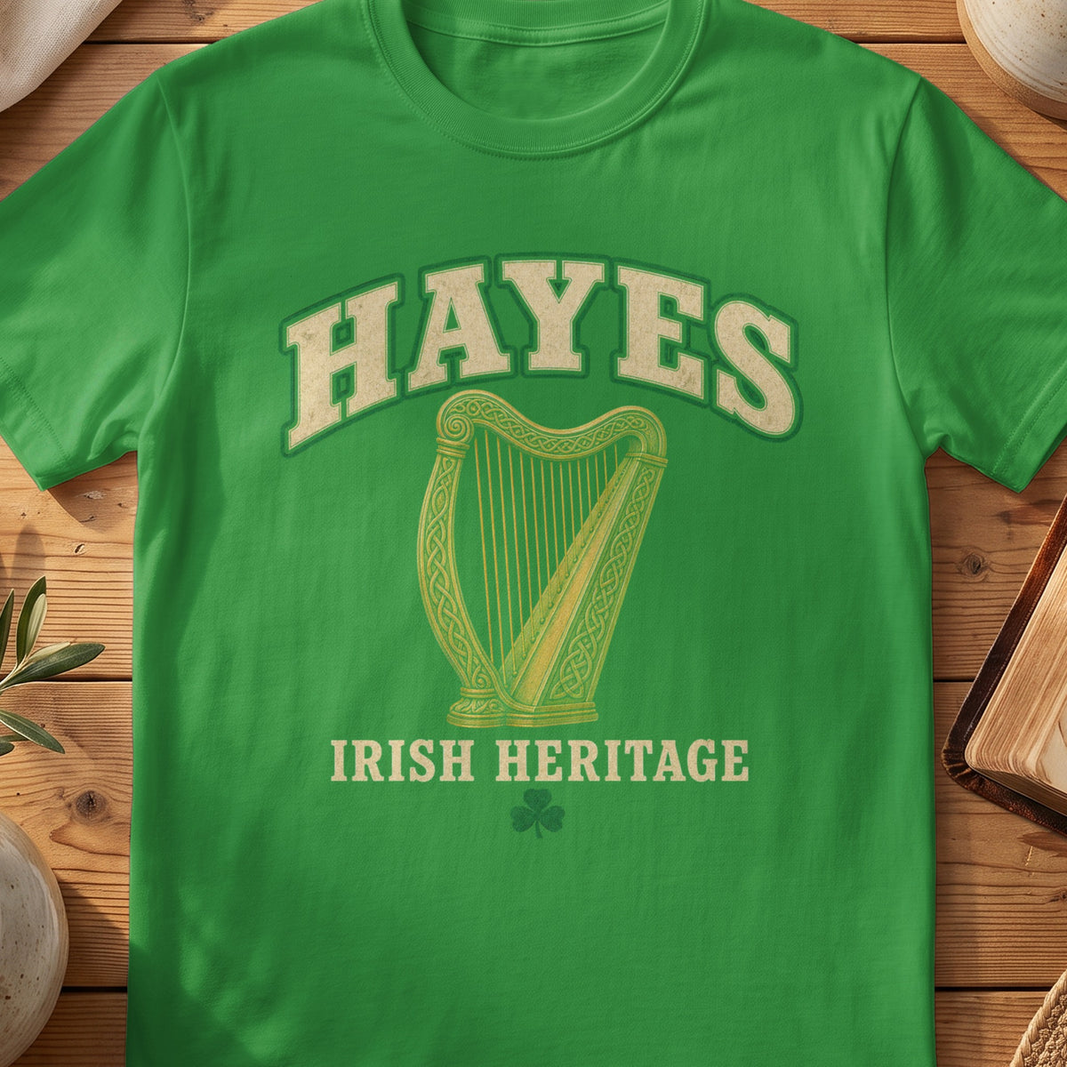 Hayes Irish harp T-shirt in Irish Green, with cream surname lettering, a gold-toned harp, green shamrock and “Irish Heritage” text.