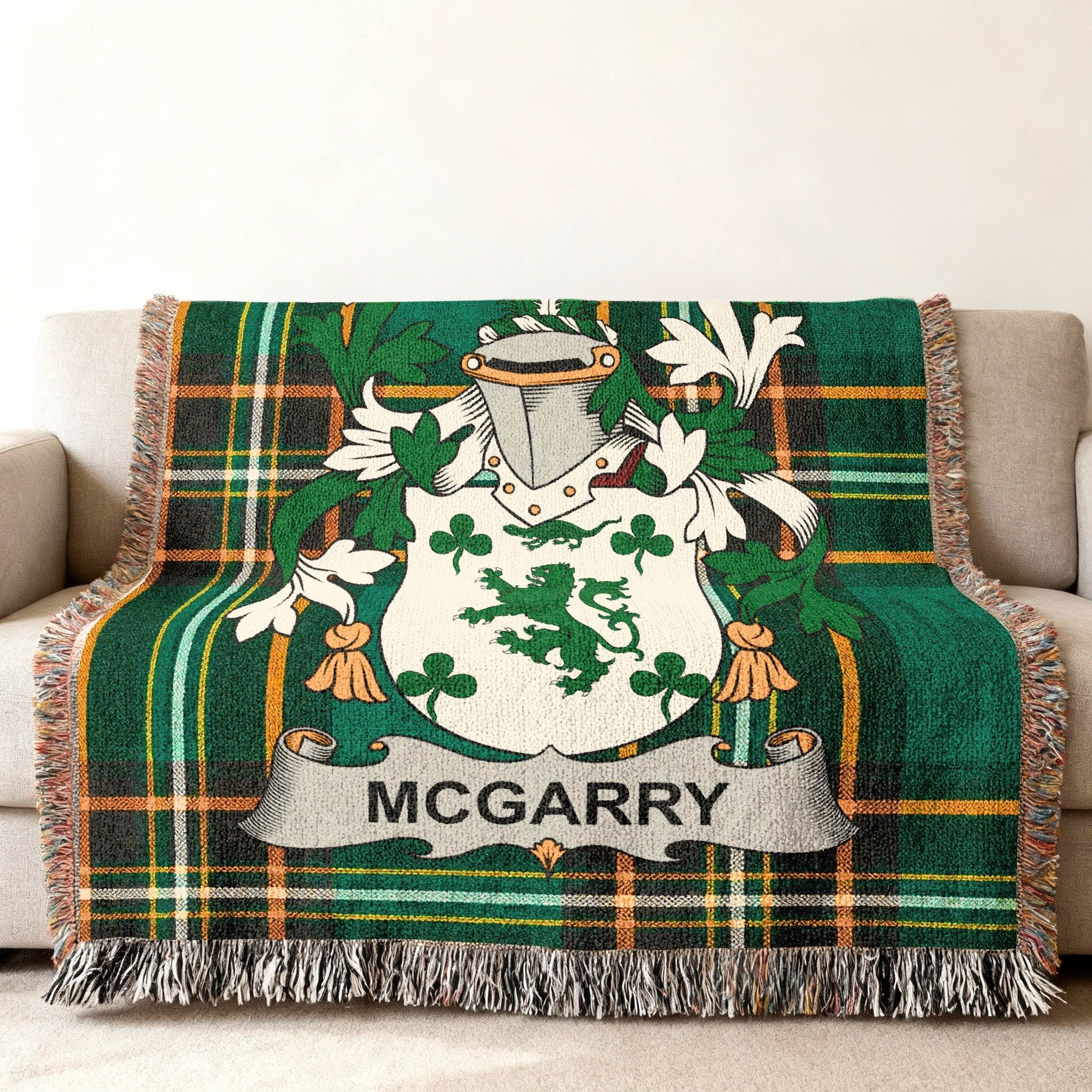 Mc Garry family crest on a green and gold plaid throw blanket.