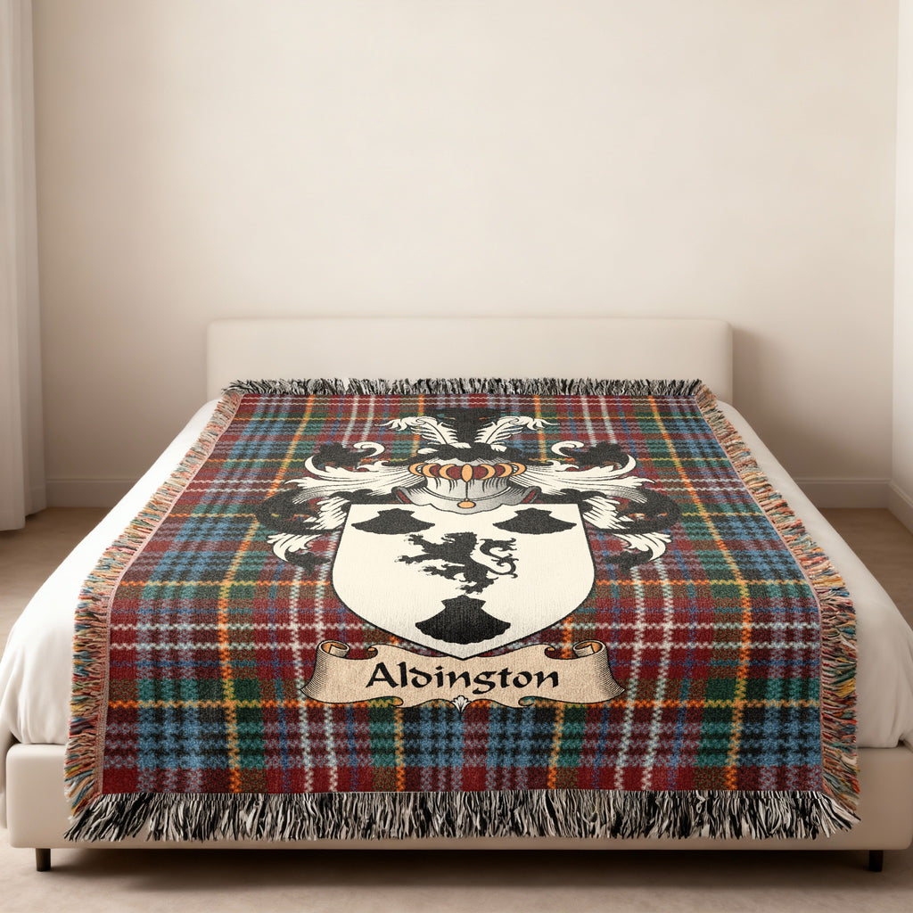 Alsington family crest emblem on a Caledonia tartan woven blanket