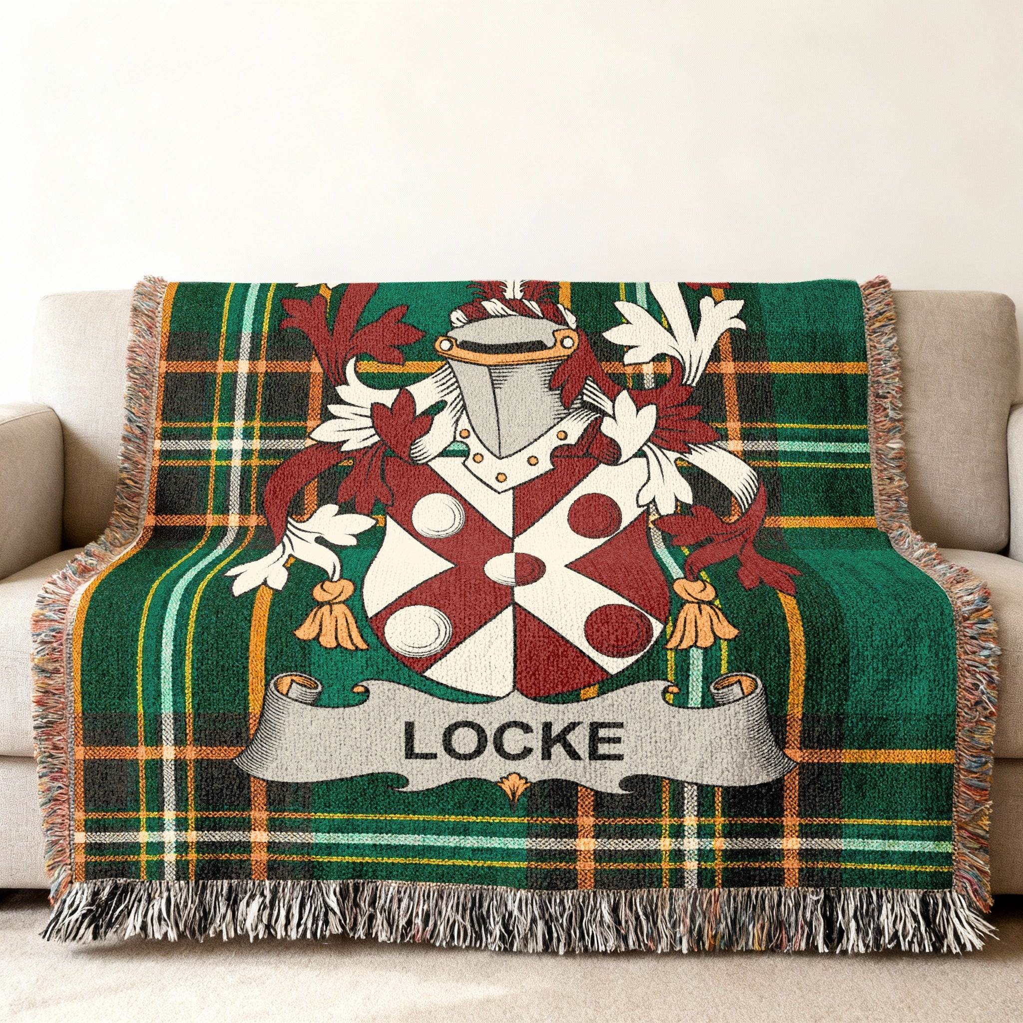 Tartan blanket with Locke family crest in green and red plaid.