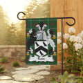 Green plaid family crest flag with the name "Rees" below a shield.