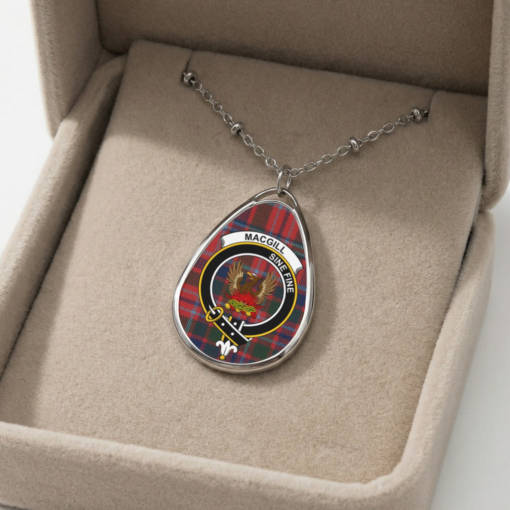 Oval necklace pendant with MacGille tartan and crest in a beige jewelry box