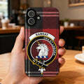 Clan Ramsay tartan phone case — glossy edge-to-edge red plaid print, iPhone shown