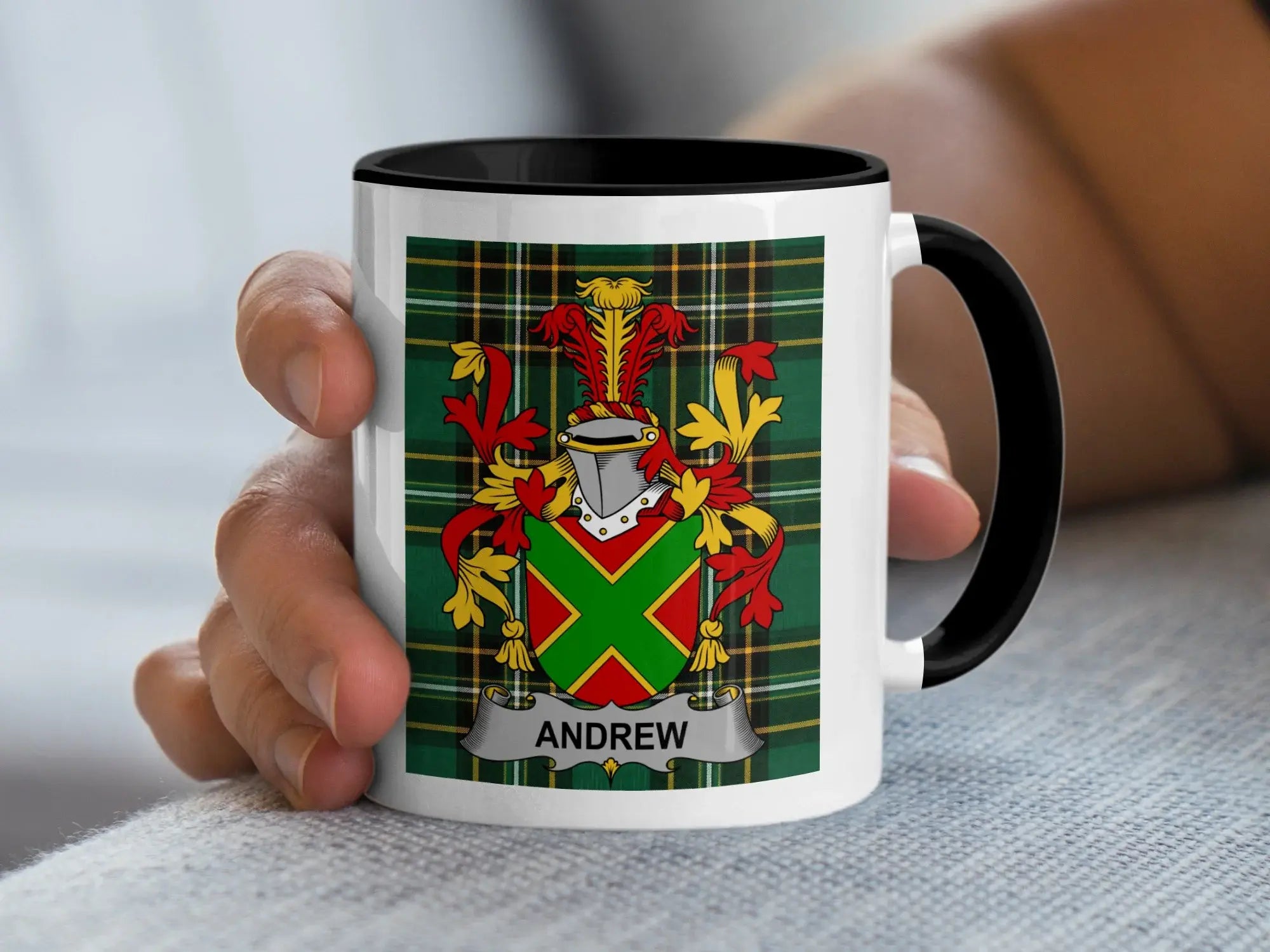 White mug with black rim featuring a Scottish tartan pattern and the surname Andrew.