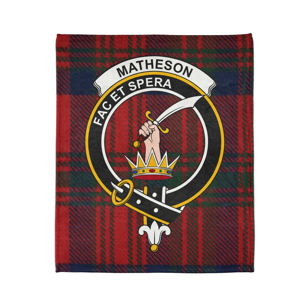 Matheson clan crest and Fac Et Spera motto detail on tartan throw blanket — printed polyester