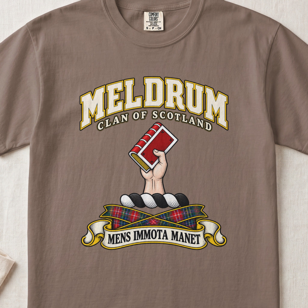 Meldrum Scottish clan T-shirt in Espresso, front view with a hand holding a red book and motto banner.