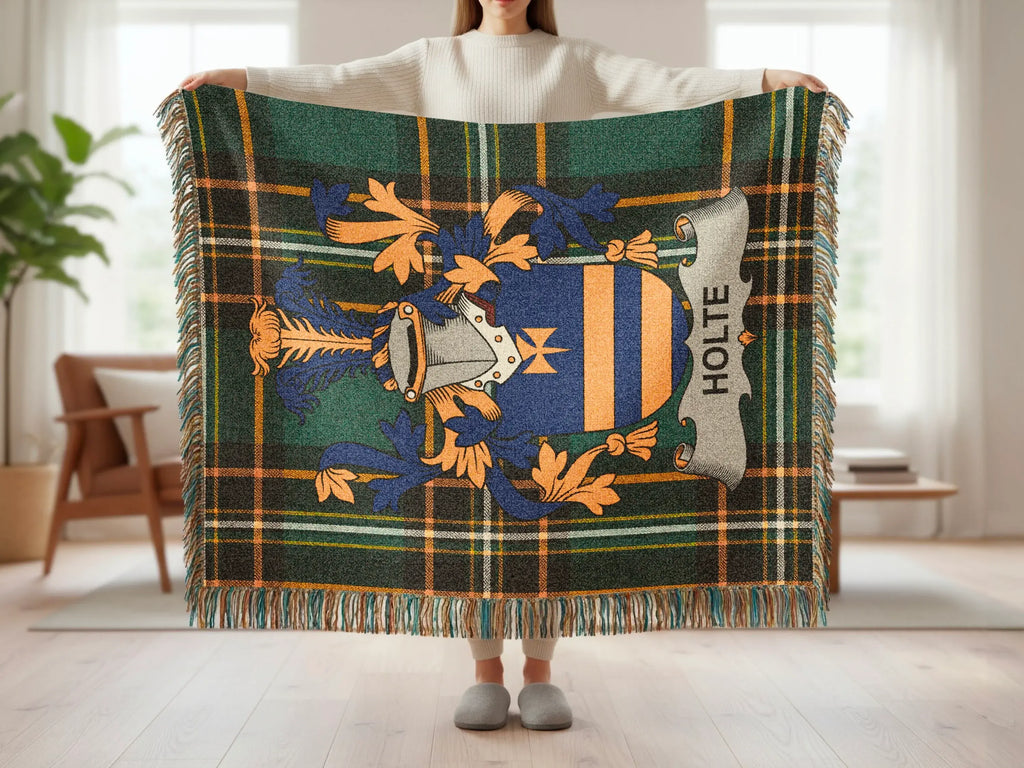 Holte family crest on a green plaid woven throw blanket.