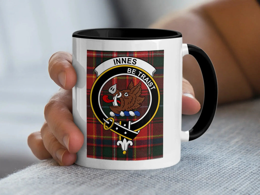 Innes clan tartan accent mug — glossy white ceramic with boar's head crest and Be Traist motto, black handle