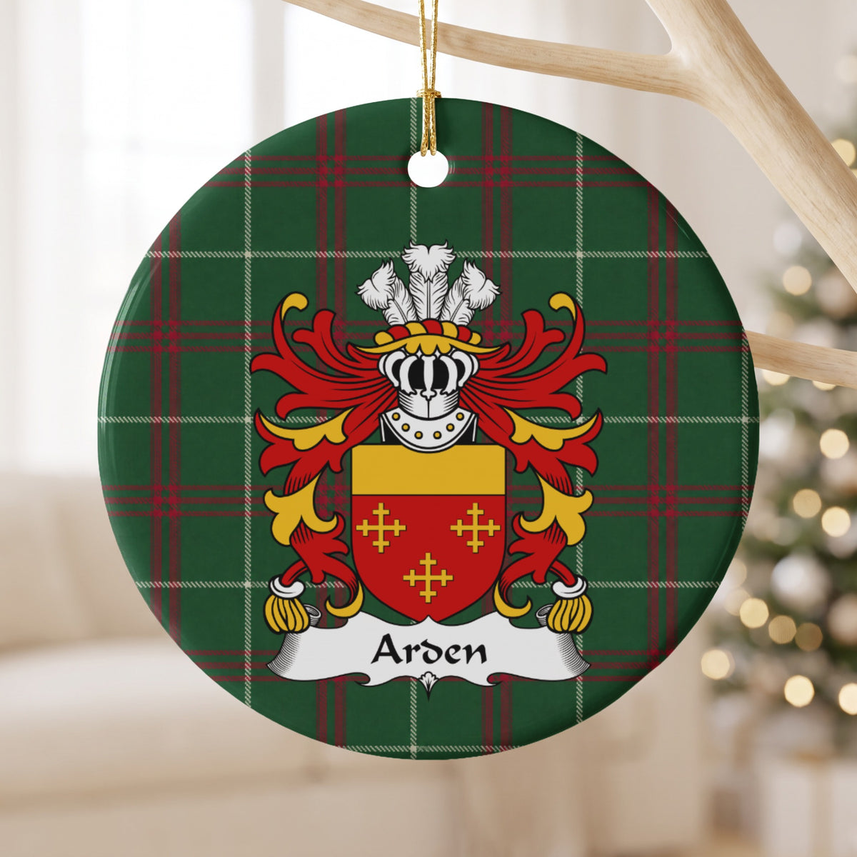 Arden ornament hanging from a pale branch; three small gold crosses on red beneath a plain gold top band on Welsh national tartan.