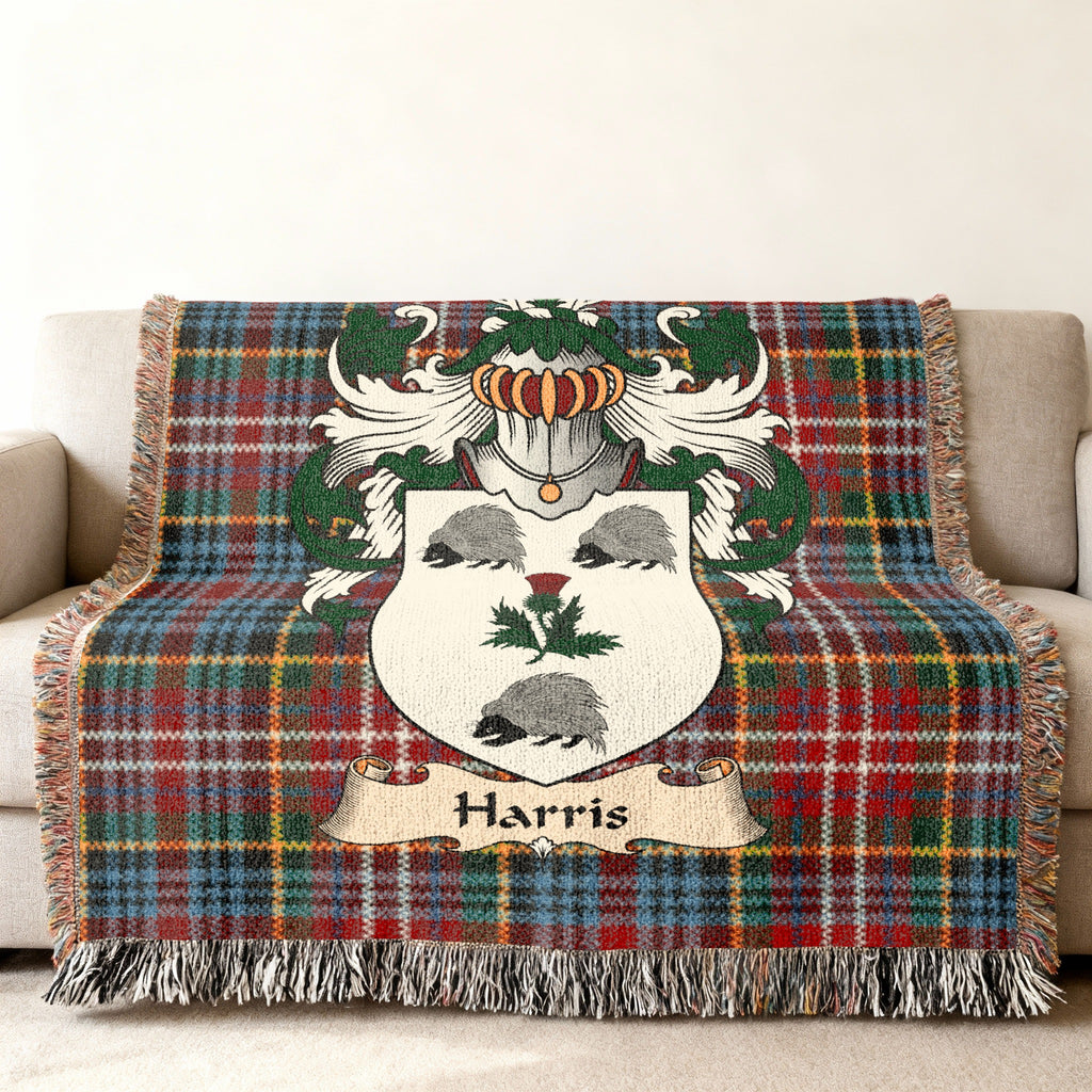 Harris family crest emblem on a Caledonia tartan woven blanket
