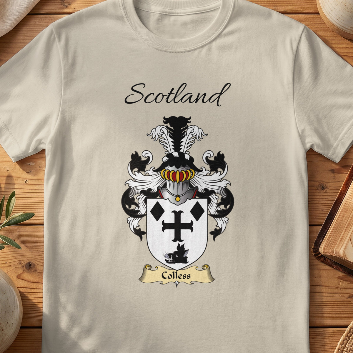 Sand Colless Scottish family shield T-shirt featuring a black cross and diamond motifs on white