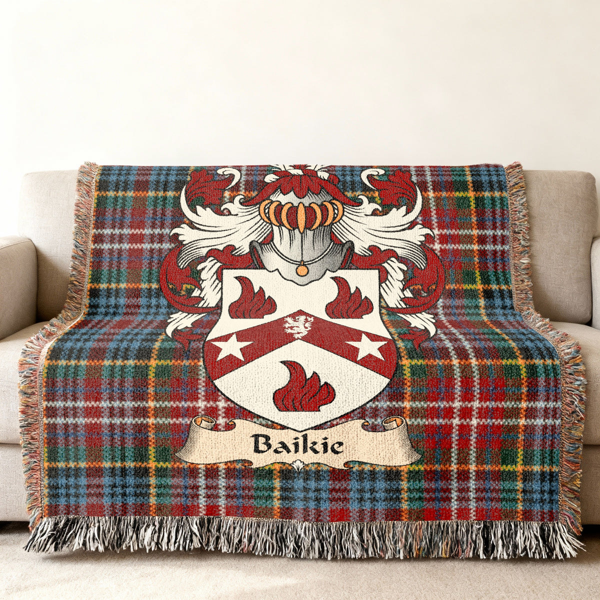 Baikie Scottish family shield woven blanket on a Caledonia tartan background