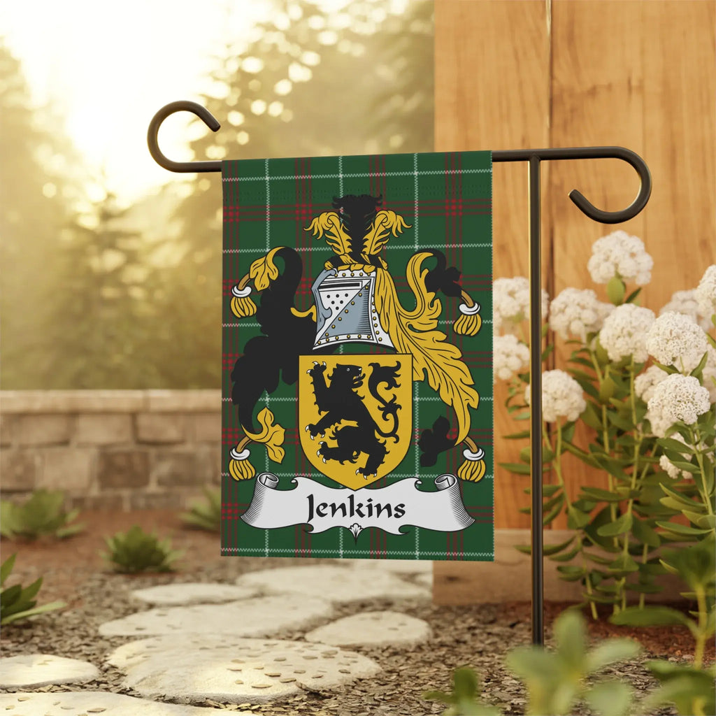 Jenkins family crest on a green plaid garden flag displayed outdoors.