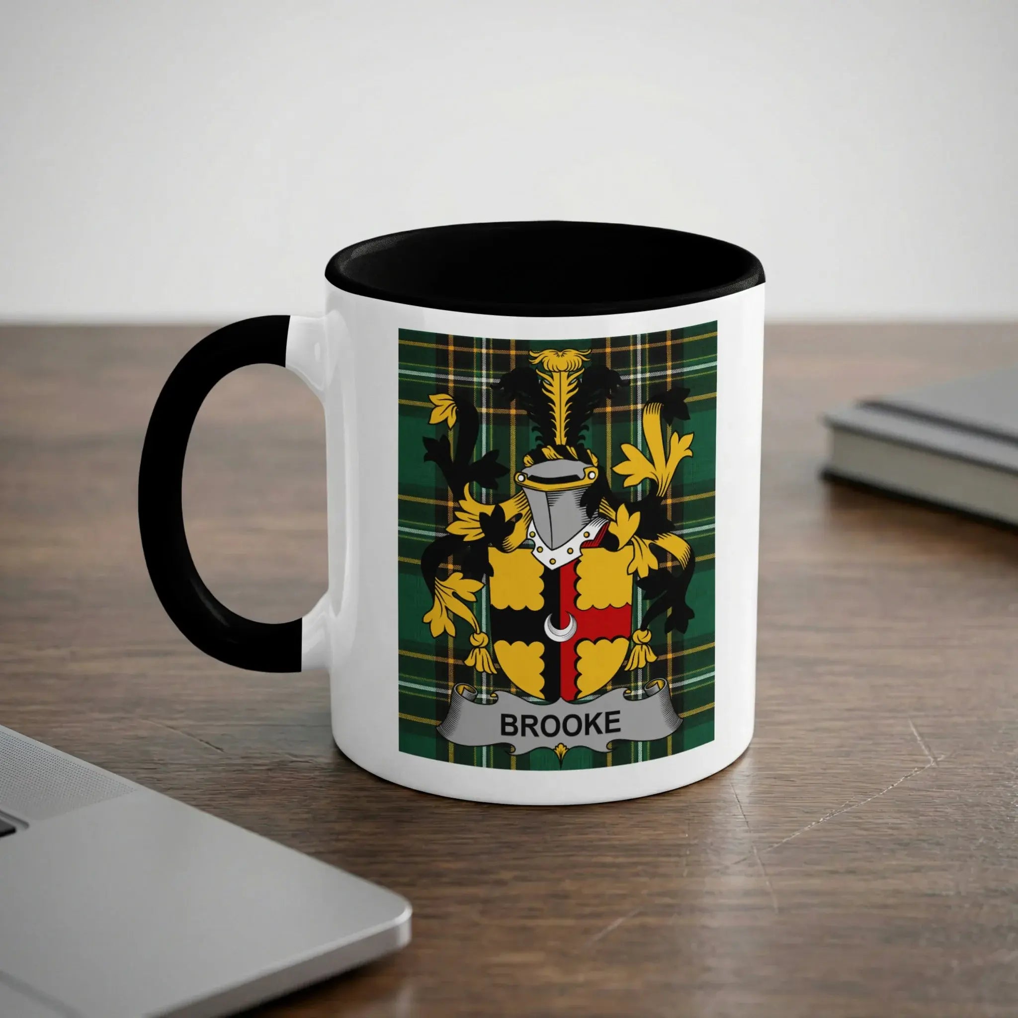 White mug with black rim and handle displaying a family crest with the name "Brooke".