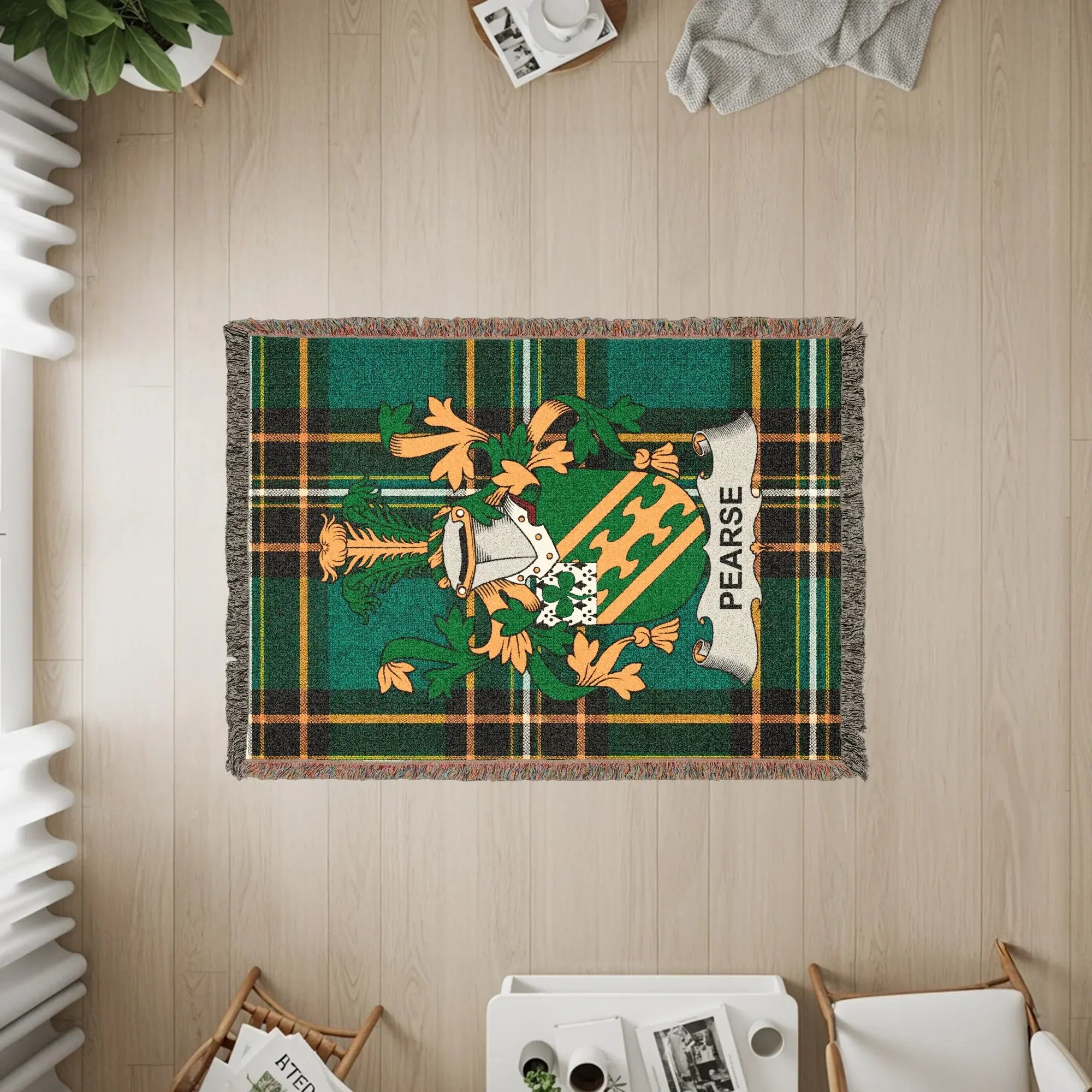 Green plaid tapestry with Pearse coat of arms and tassel fringe.