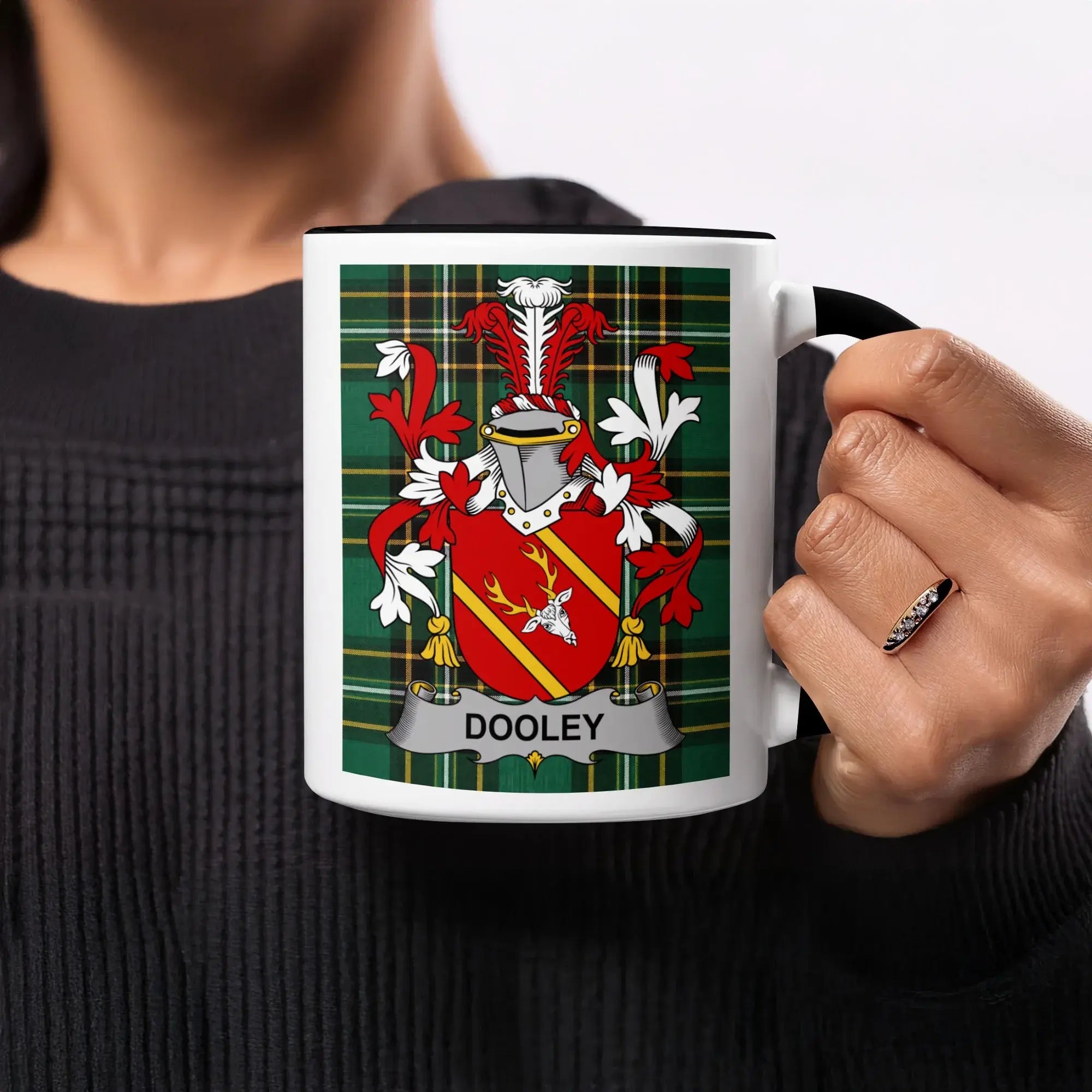Mug featuring the Dooley family crest on a tartan background.