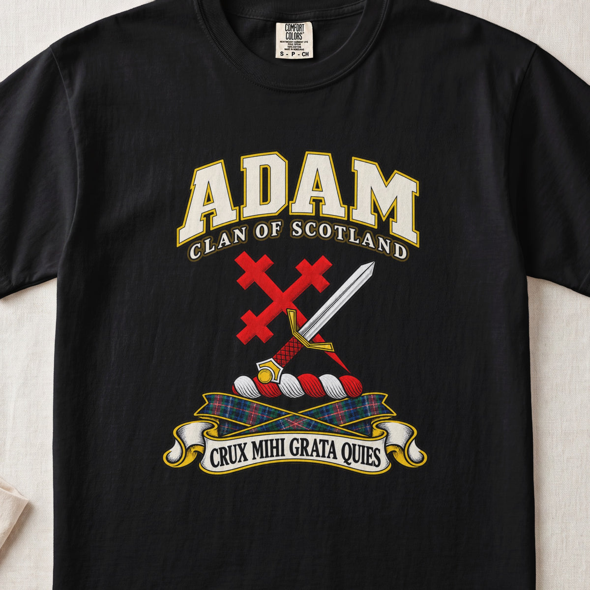Adam Scottish clan T-shirt in Black, front view with a silver sword crossed with a red cross and motto banner.