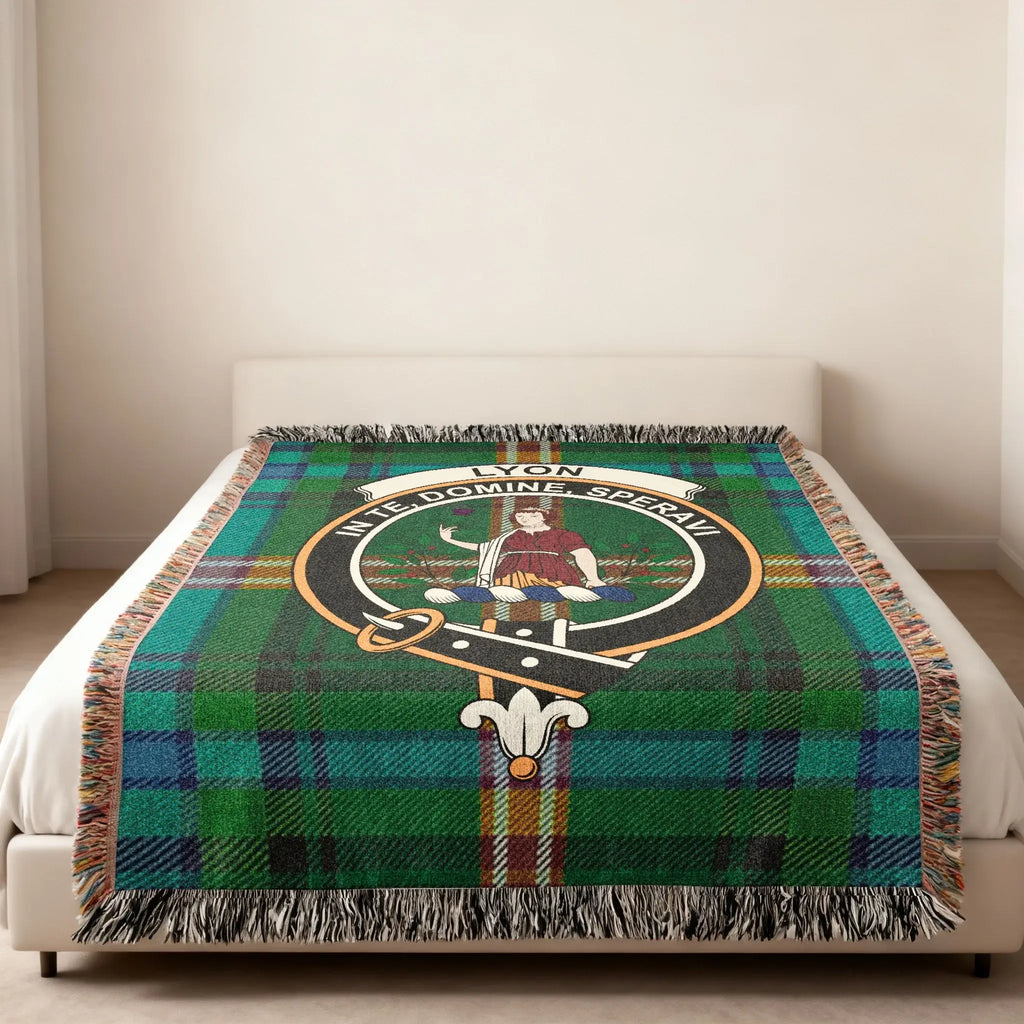 Clan Lyon In Te Domine Speravi woven blanket — lifestyle shot showing fringe border and green tartan