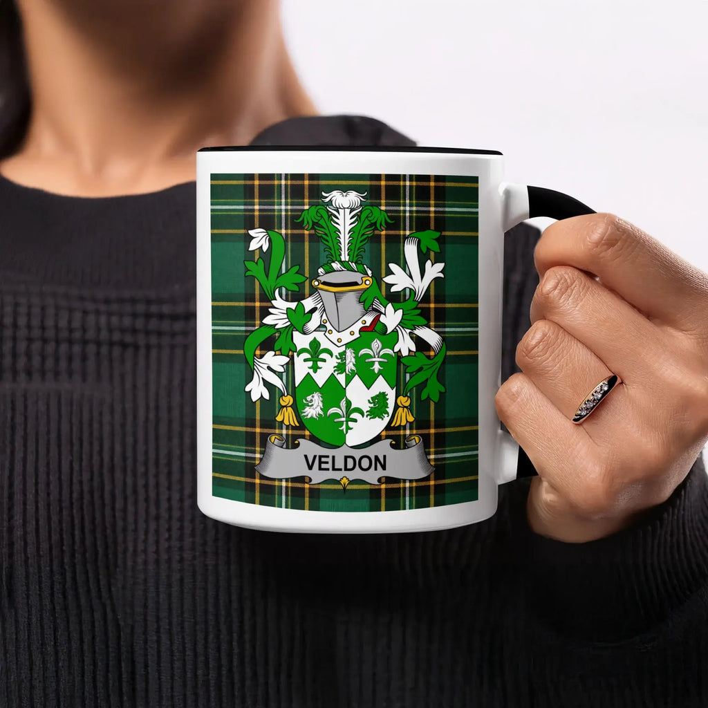 Mug with green plaid background and "VELDON" coat of arms.
