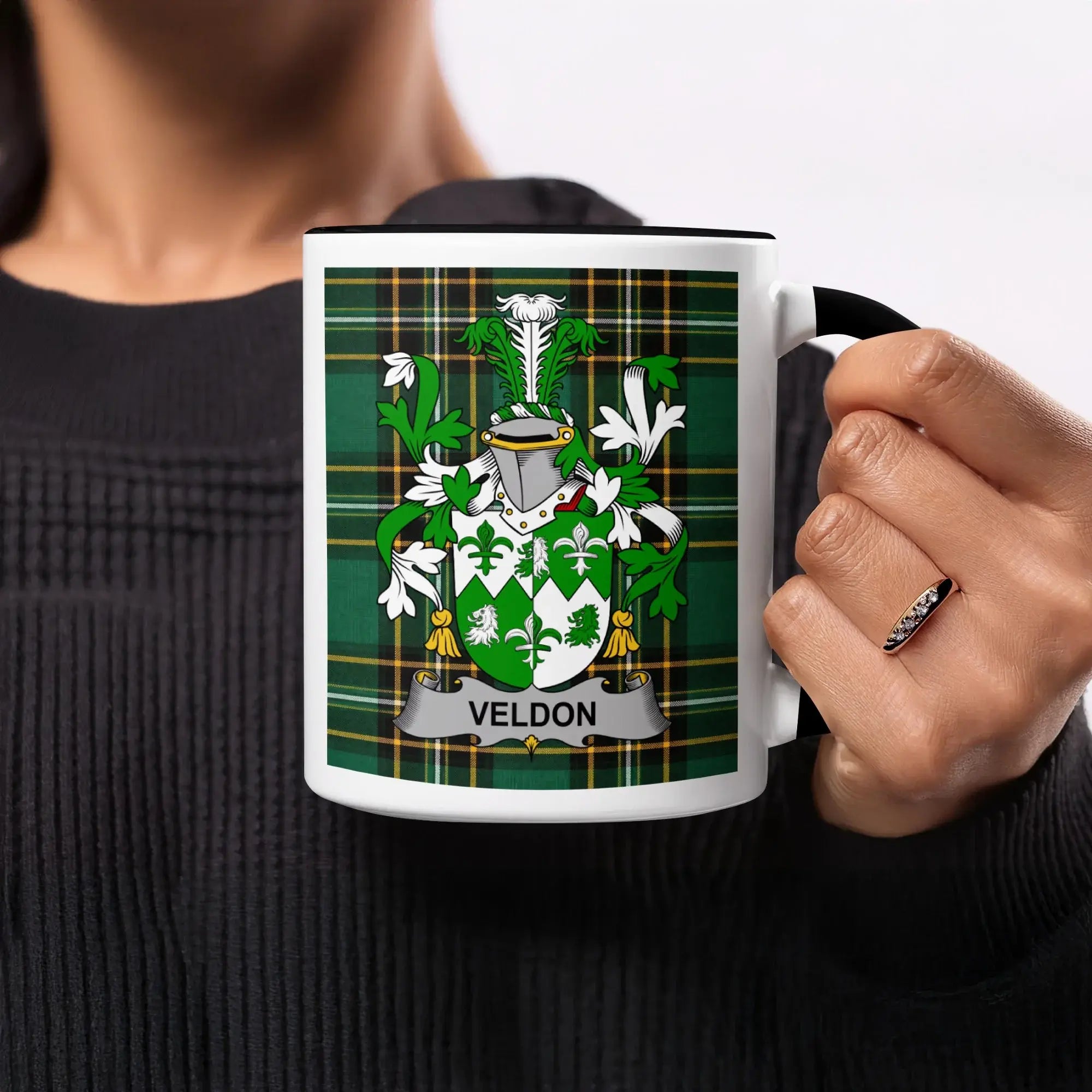 Mug with green plaid background and "VELDON" coat of arms.