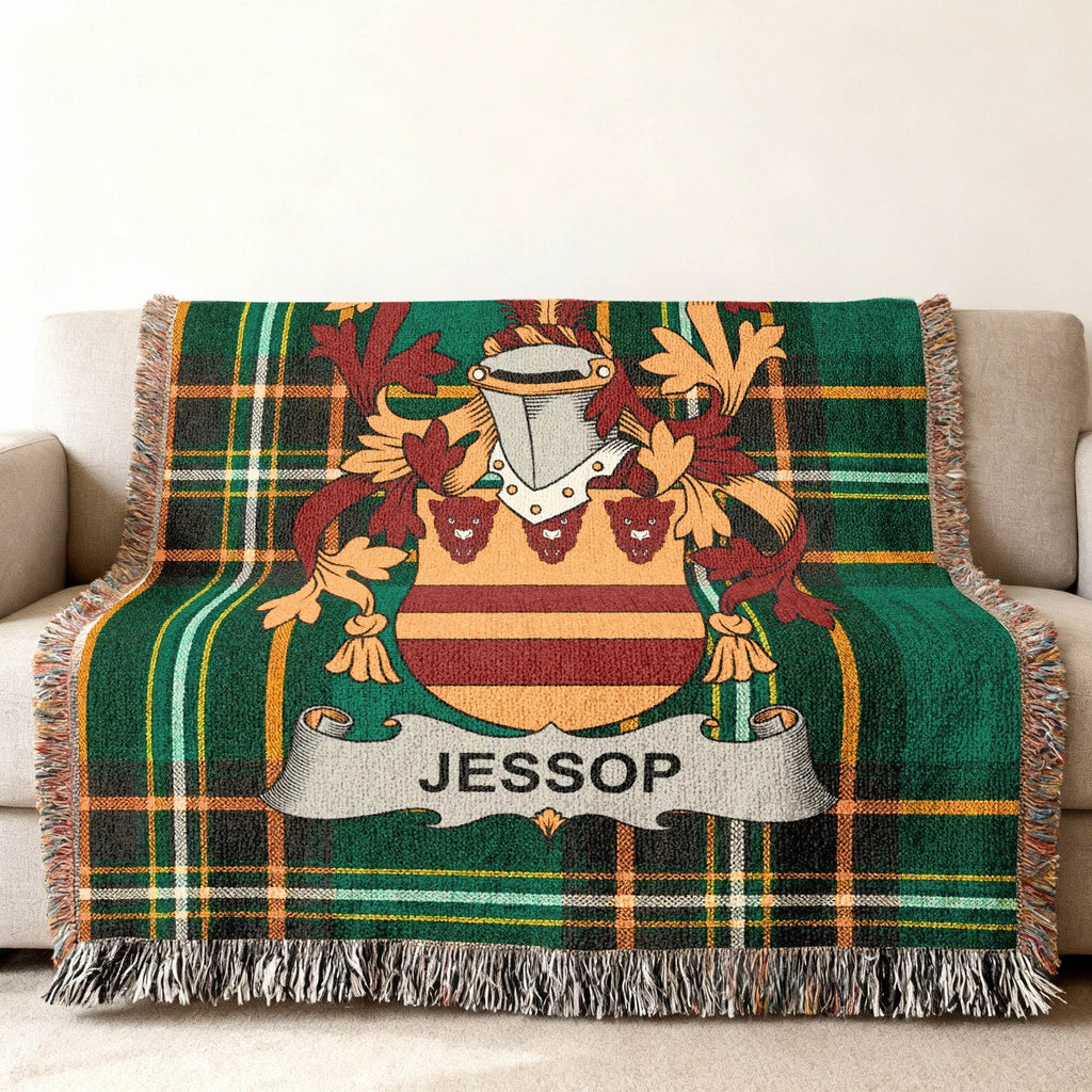Woven tartan throw blanket with the Jessop family crest displayed prominently.
