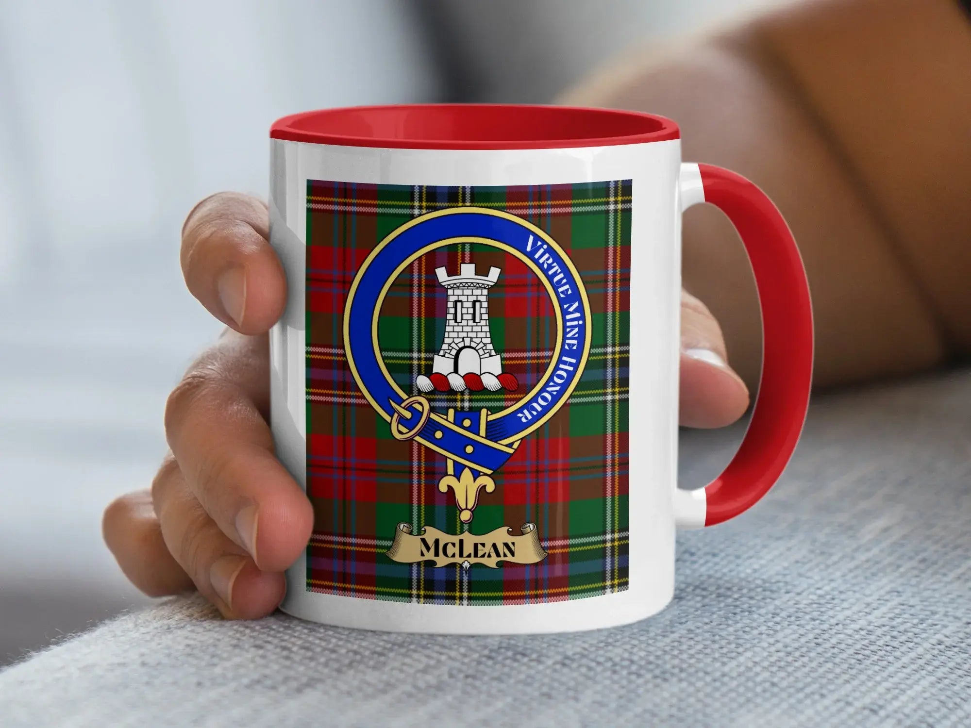 Tartan mug with McClean clan crest and red handle.