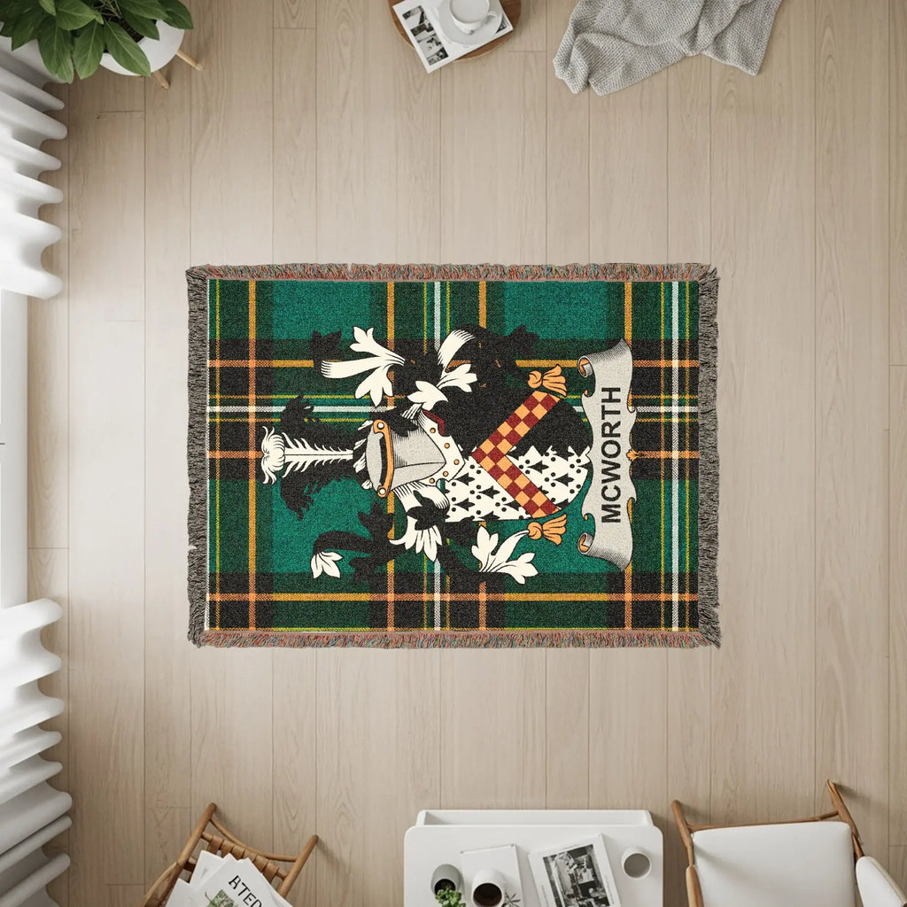 McWorthy tartan crest woven blanket with fringe detail.