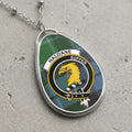 Haldane clan Scottish tartan necklace with clan crest on tartan background