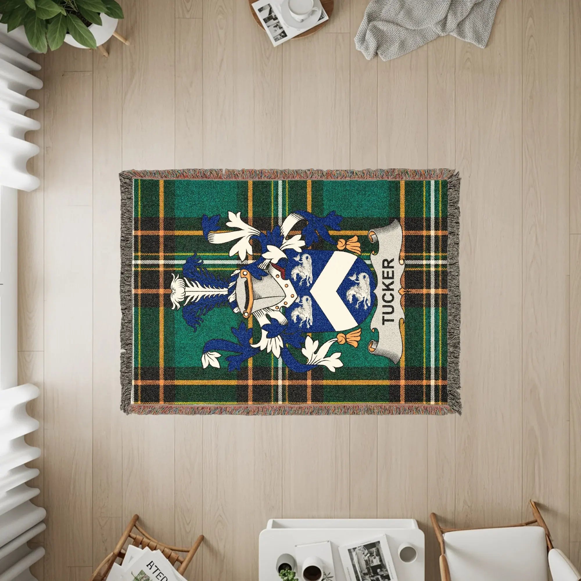 Green and blue plaid throw blanket with Tucker family crest.