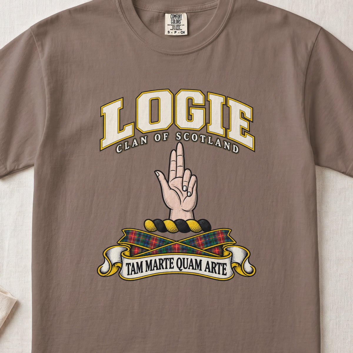 Logie Scottish clan T-shirt in Espresso, front view with a raised hand with two fingers extended and motto design.