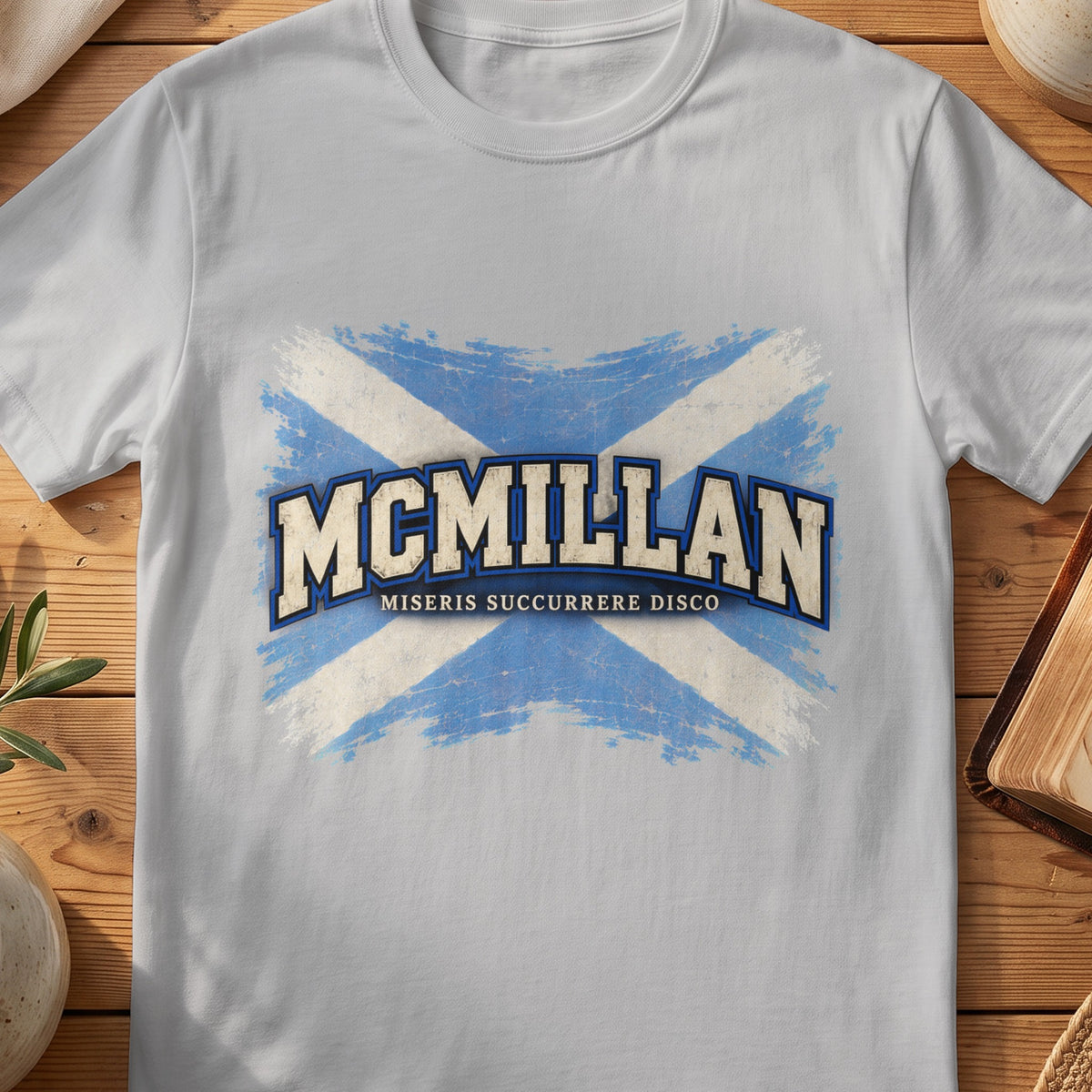McMillan Scottish Saltire T-shirt in Sport Grey, with distressed blue and cream flag and “Miseris Succurrere Disco” lettering.
