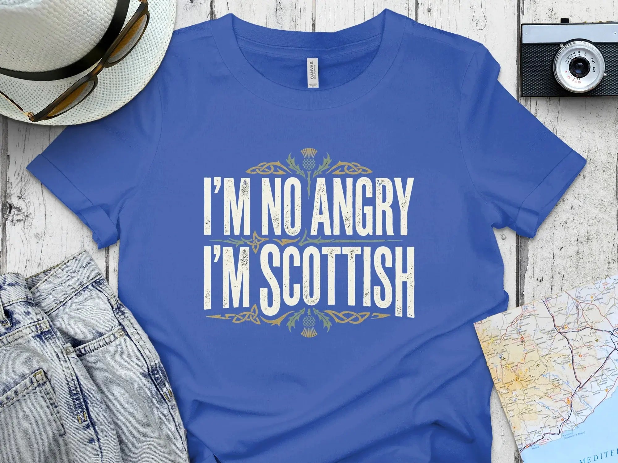 Blue t-shirt with "I'm No Angry I'm Scottish" text and thistle design.