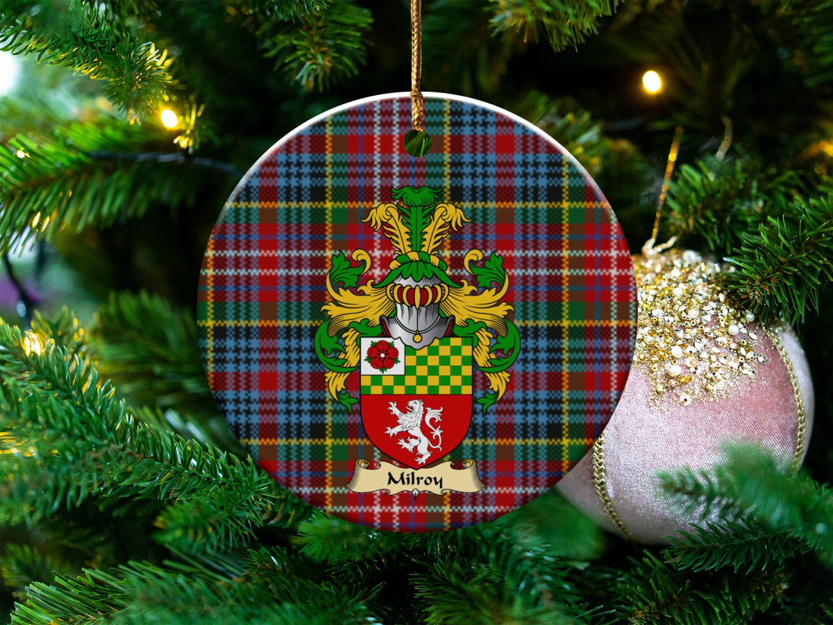 Milroy Scottish clan ceramic ornament with family crest on a Caledonia tartan background, hanging on a Christmas tree