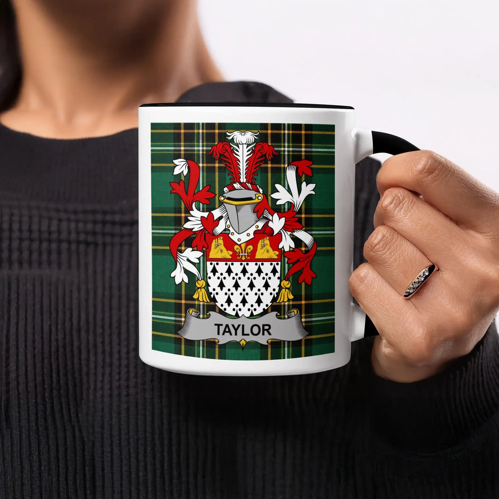 Taylor family crest on a white mug with a plaid border.