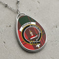 Erskine clan Scottish tartan necklace with clan crest and Je Pense Plus motto on tartan background