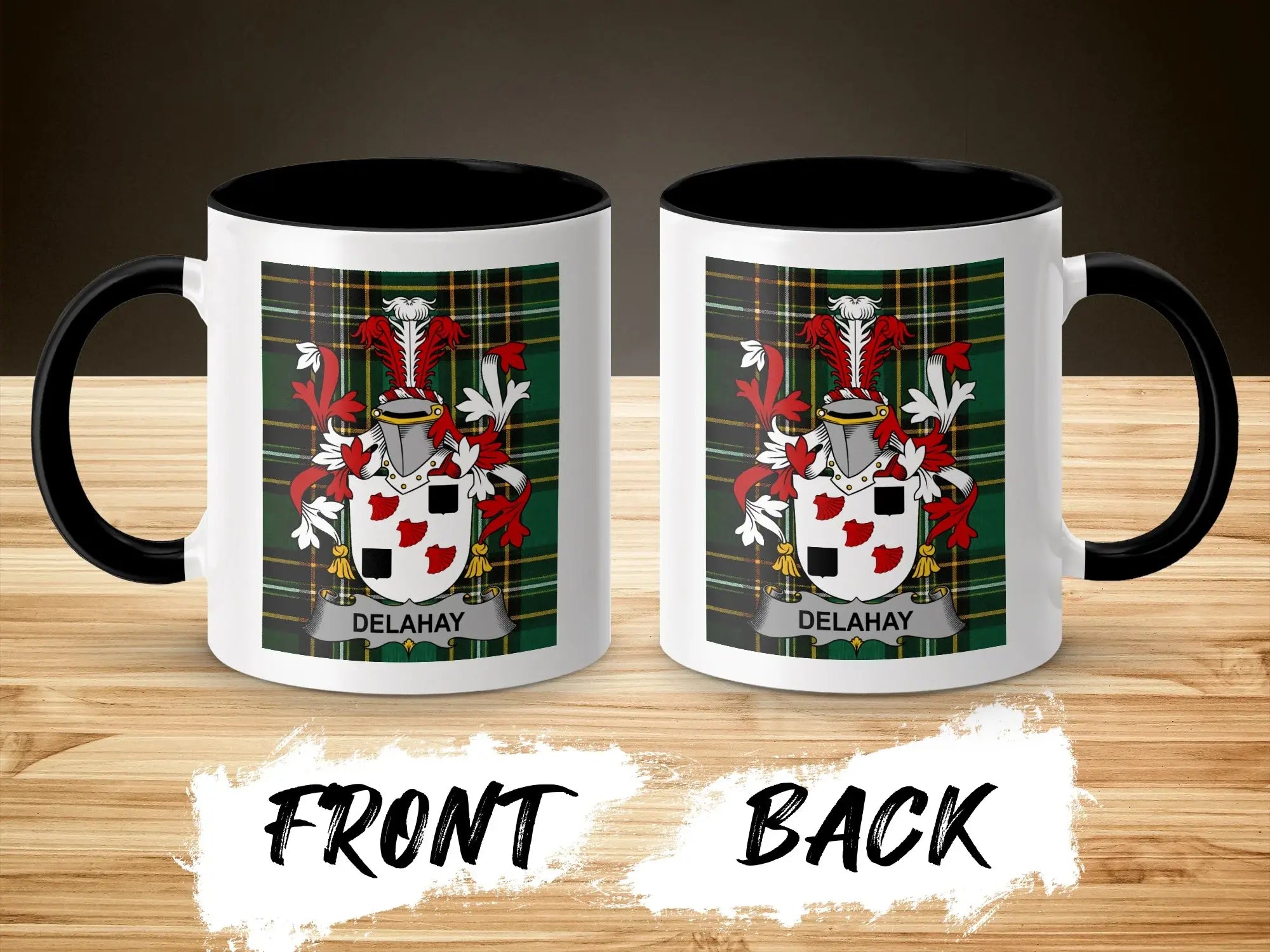 Two white mugs with black rims and handles, displaying the DELAHAY family crest.