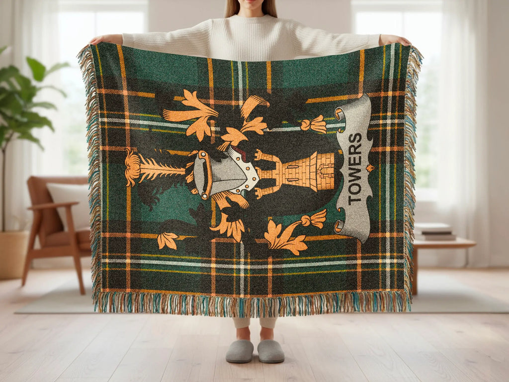 Green plaid throw blanket with crest and "TOWERS" text.